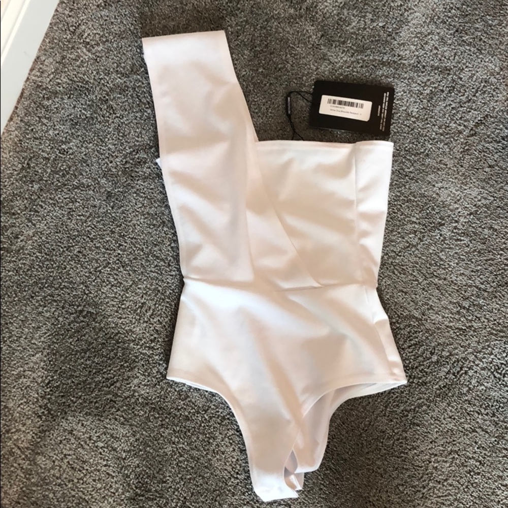 white, one shoulder body suit